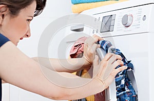 Young housekeeper learning to launder