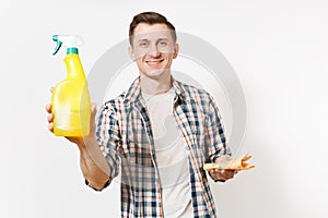 Young housekeeper man holding cleaning rag, white blank empty spray bottle with cleaner liquid isolated on white