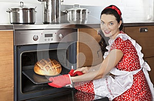 Young housewife baking bread