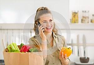 Young housewife sort purchases after shopping