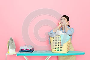 Young houseworker woman preparing ironing clothing