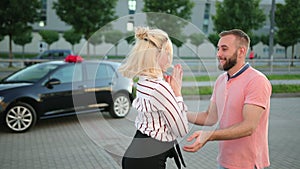 Young husband, man is giving car gift wife, girlfriend. Extremely happy woman