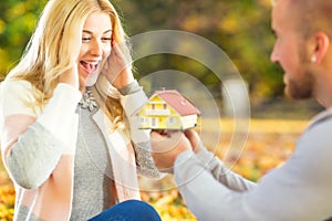 Young Husband surprises with new family house.