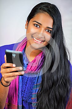 Young india woman with smartphone 5