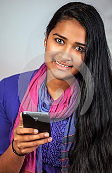 Young india woman with smartphone 6