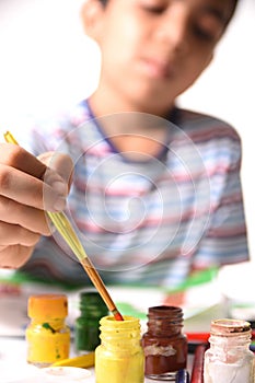 Young Indian Boy drawing and painting