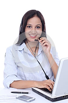 Young Indian call centre woman with headset