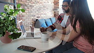 Young indian couple chatting with relatives via videoconference videocall application. Distant virtual communication