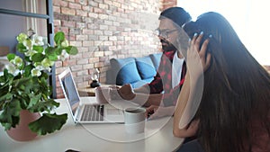 Young indian couple chatting with relatives via videoconference videocall application. Distant virtual communication