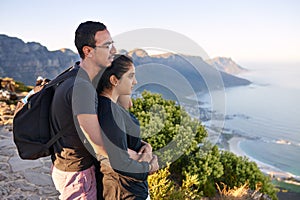 Young Indian couple on a nature hike enjoying the view