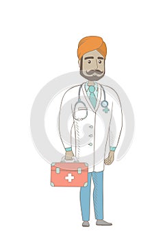 Young indian doctor holding first aid box.