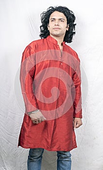 Young indian male model wearing red kurta