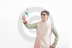 Young Indian man holding Indian flag