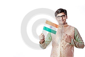 Young Indian man holding Indian flag