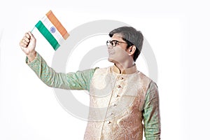 Young Indian man holding Indian flag