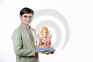 Young Indian man with Lord Ganesha , Celebrating Ganesh festival