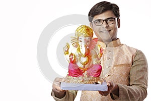 Young Indian man with Lord Ganesha , Celebrating Ganesh festival