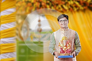 Young Indian man with Lord Ganesha , Celebrating Ganesh festival