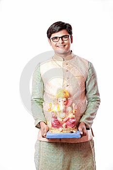 Young Indian man with Lord Ganesha , Celebrating Ganesh festival