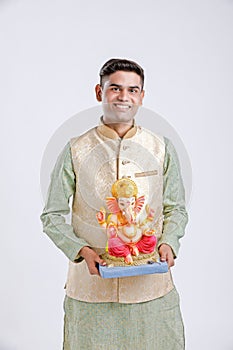 Young Indian man with Lord Ganesha , Celebrating Ganesh festival