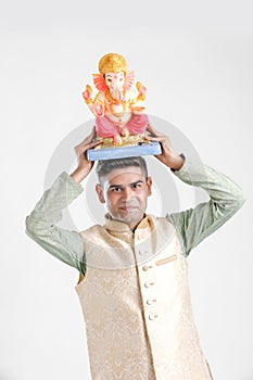 Young Indian man with Lord Ganesha , Celebrating Ganesh festival
