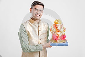 Young Indian man with Lord Ganesha , Celebrating Ganesh festival