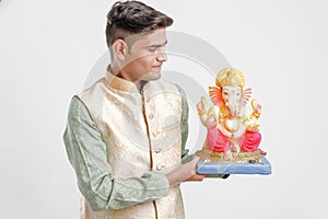 Young Indian man with Lord Ganesha , Celebrating Ganesh festival