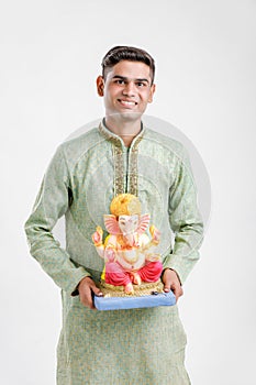 Young Indian man with Lord Ganesha , Celebrating Ganesh festival