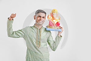 Young Indian man with Lord Ganesha , Celebrating Ganesh festival