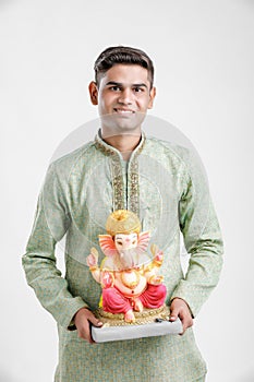 Young Indian man with Lord Ganesha , Celebrating Ganesh festival