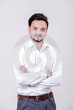 Young indian man Standing isolated over white background