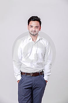 Young indian man Standing isolated over white background