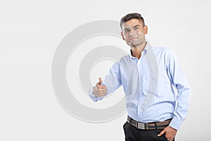Young Indian Man Wearing suit and showing thumps up photo