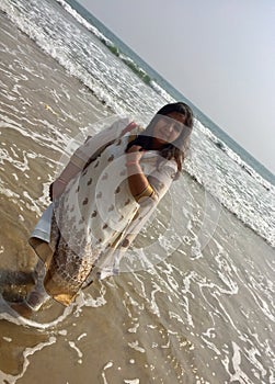 An young Indian woman in the beach
