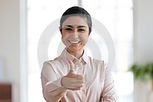 Young indian woman showing thumbs up gesture