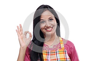 Young Indian woman wearing kitchen apron