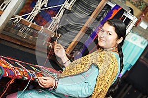 Young indian woman weaver