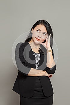 Young Indonesian woman is imagining and thinking while looking up