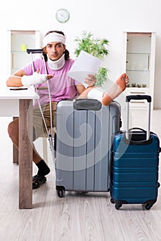 Young injured man preparing for the trip