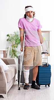 Young injured man preparing for the trip