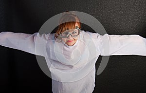 Young insane woman with straitjacket with pilot glasses