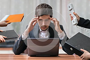 Young intend and thinking busy businessman is working with computer.