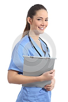 Young intern nurse posing holding a medical history