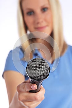 Young interviewer holding a microphone photo