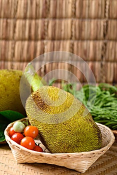 Young jackfruit and local vegetables in a basket