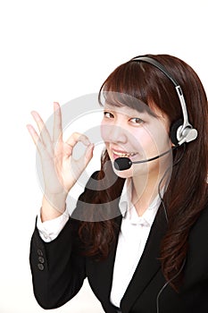 Young Japanese businesswoman of call center with head sets