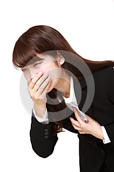 Young Japanese businesswoman feels like vomiting