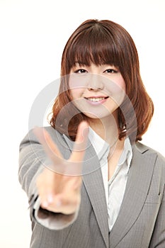 Young Japanese woman showing a victory sign