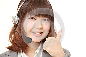 Young Japanese businesswoman with thumbs up gesture