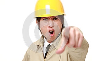 Young Japanese construction worker scolding